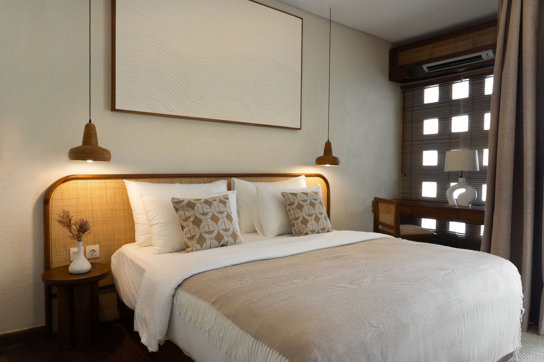 Two spacious bedrooms with king-size beds, ensuite bathrooms, and calming décor